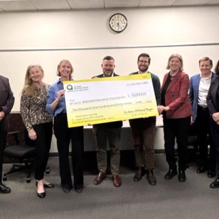 AMP presents check to AEF