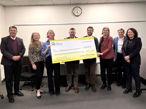 AMP presents check to AEF